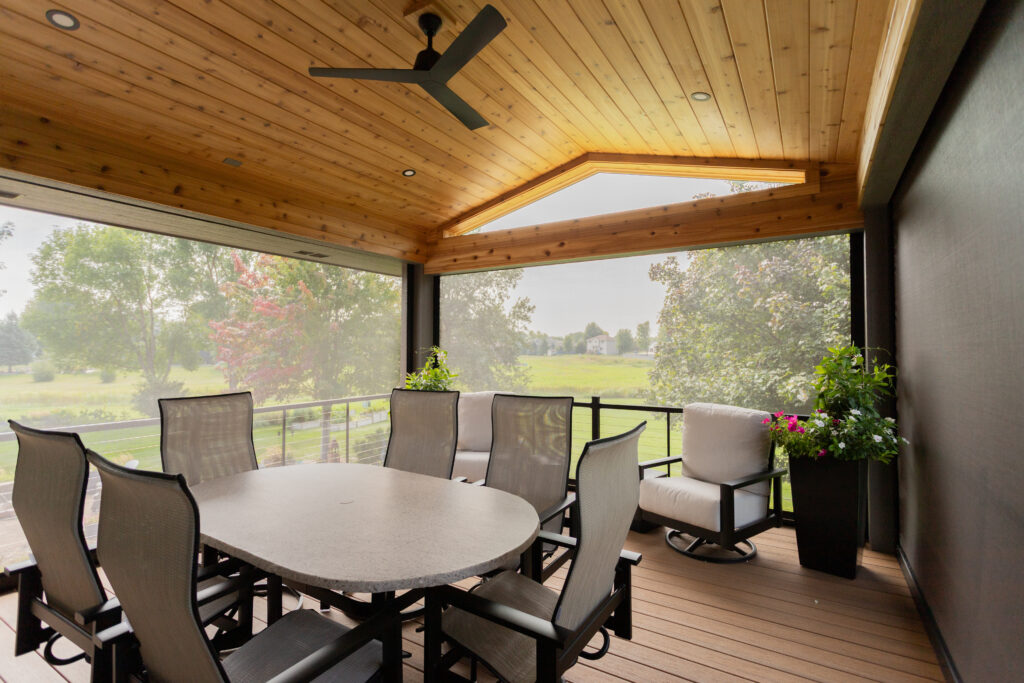 Enclosed deck with motorized screens