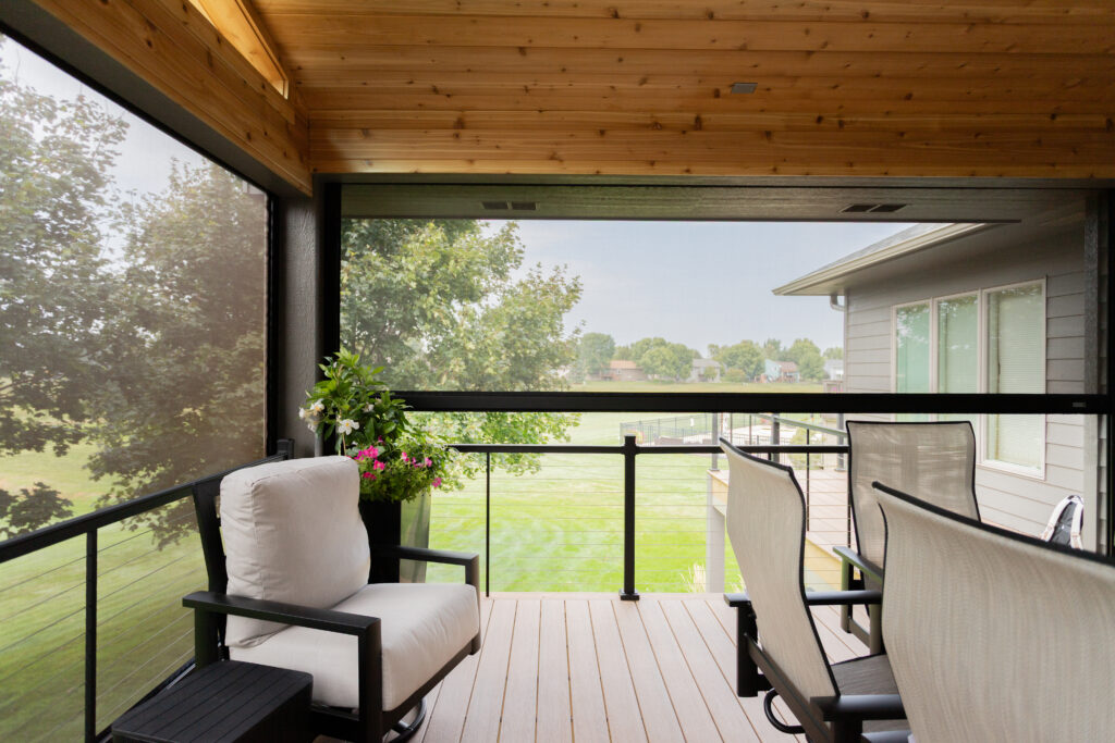 Enclosed deck with motorized screens hidden.