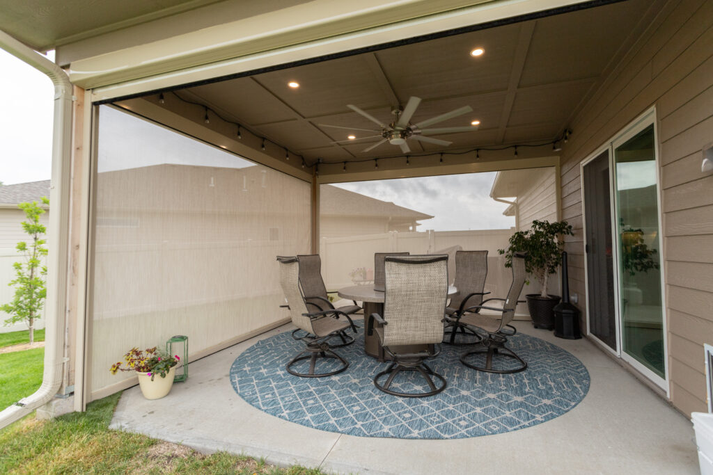 Enclosed deck with motorized screens exposed.