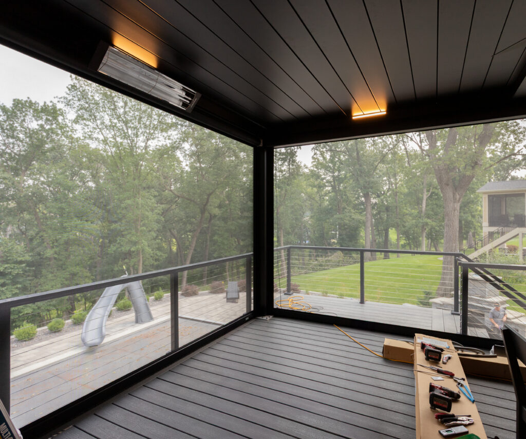 aluminum pergola in Rochester, Minnesota installed on a deck with motorized screens, lights, and heaters