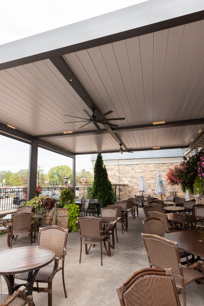 white and dark gray motorized louvered pergola