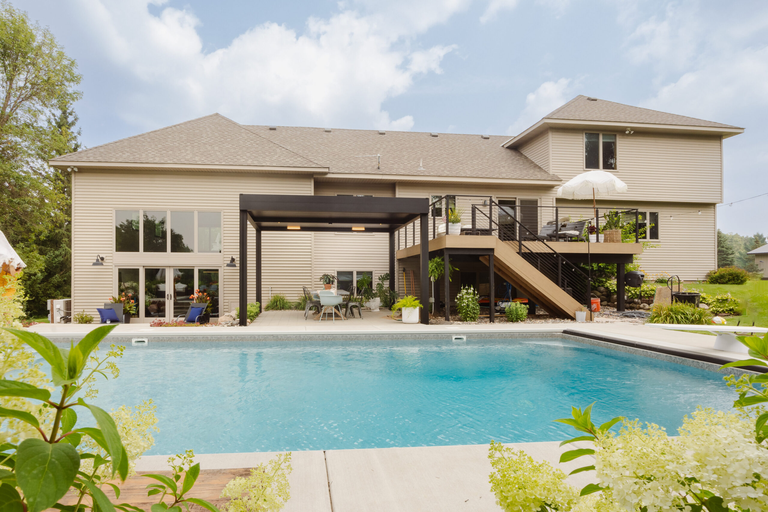 motorized pergola Minnesota installed over poolside patio in Elk River backyard