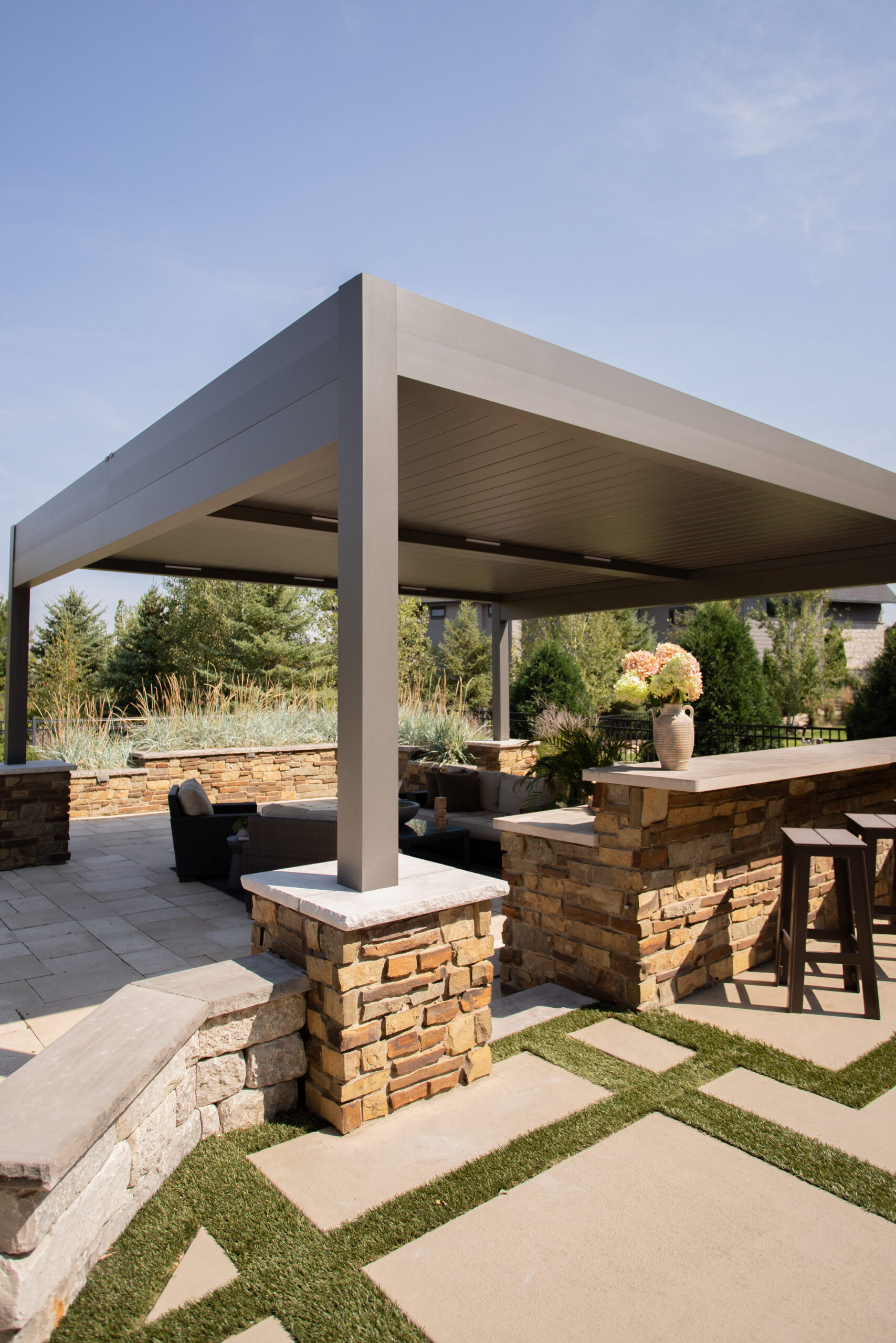 dark gray louvered pergola