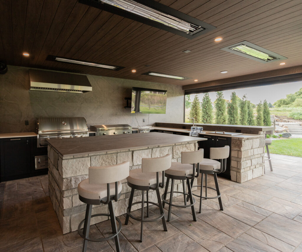 covered patio ideas - outdoor kitchen with heaters