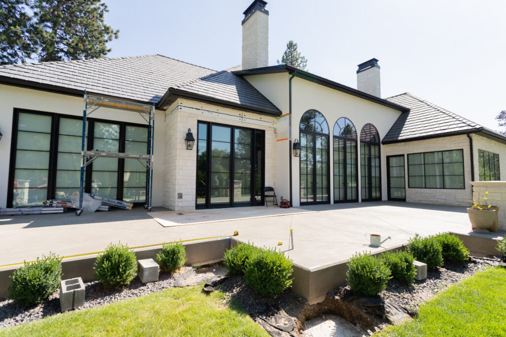 Before custom motorized pergola installation, the existing concrete patio had a strong layout, but it needed shade, privacy, and more protection from the golf course side of the property.